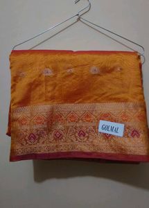 Elegant Orange Saree with Intricate Border