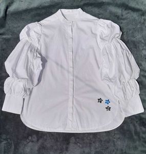 White balloon-sleeve shirt.