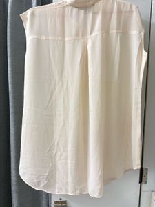 Elegant Cream Embroidered Sleeveless Blouse