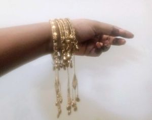 Golden Dangling Bangle Set