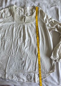 Elegant White Top with Textured Yoke