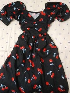 black mini dress with cherry patterns