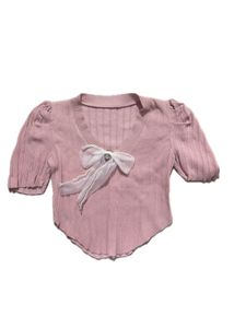 Chic Pink Ribbed Top with Bow Detail