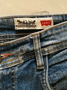 Distressed Blue Denim Jeans