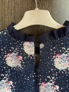 Navy Floral Sleeveless Top with Ruffle Collar
