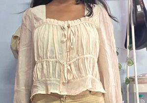 cream blouse tied top