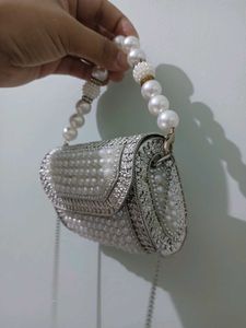 Elegant Pearl Embellished Clutch from Snatcher