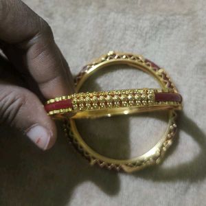 Elegant Gold Bangles with Red Accents