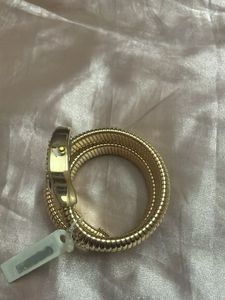 Elegant Gold Tone Coil Watch with Blue Dial