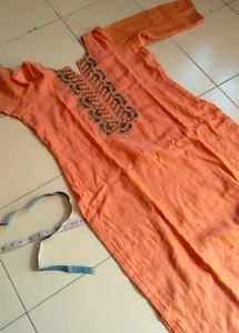 Orange Kurti with Embroidered Neckline