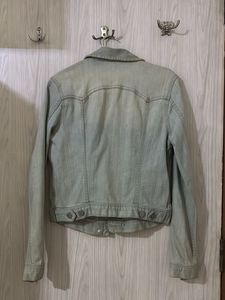 Light Wash Denim Jacket with Butterfly Brooch