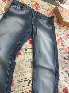 Distressed Blue Denim Jeans