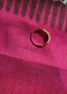 Delicate Gold Ring with Subtle Embellishments