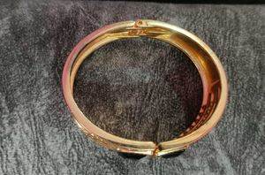 Elegant Rose Gold Bangle with Black Stones