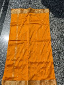 Beautiful yellow Saree with Gold Border