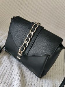 Chic Black Crossbody Bag with Chain Detail