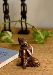 Resting Buddha on Knee Metal Showpiece