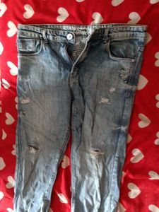 Distressed Blue Denim Jeans