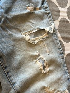 Distressed Light Wash Denim Jeans