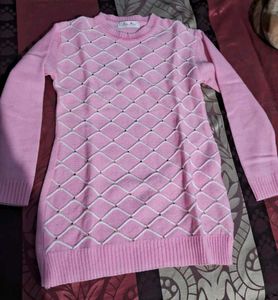 cute pink woole  top with white design and stones