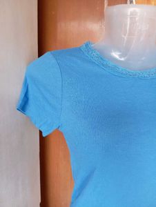 Blue Ribbed Lettuce Hem Top