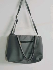 Stylish Grey Tote Bag with Pom-Pom Accent