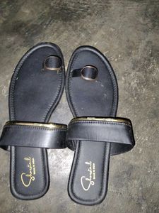 Stylish Black Flat Sandals with Gold Accent