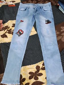 Light Wash Jeans with Funky Patches