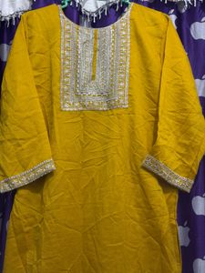 Elegant Yellow Kurti pant with Intricate Neckline