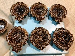 Set of New 9 ceramic designer diyas together.