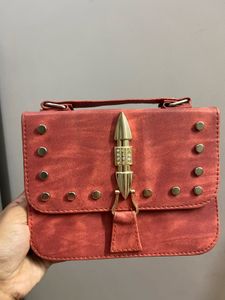 Stylish Red Crossbody Bag with Gold Embellishments