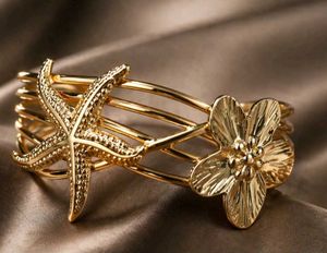 Gold Tone Starfish & Flower Bangle