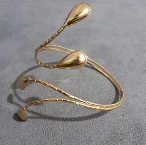 Elegant, Trendy Gold Spiral Arm Cuff