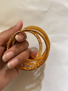 Elegant Gold Tone Bangle Set