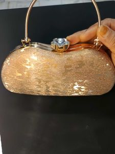 Elegant Golden Party Clutch with Crystal Lock
