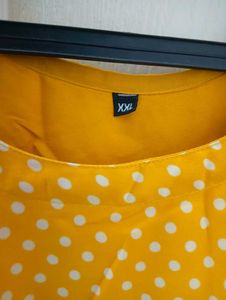 yellow long frockwith white dots