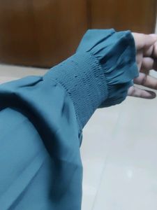 It's a Primo Knot Brand Shirt Style Top