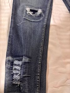 Distressed Blue Denim Jeans