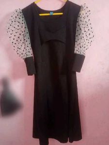 Chic Black Dress with Polka Dot Sleeves