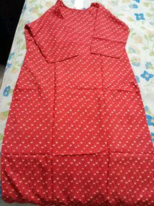 Red printed kurta with matching nail polish