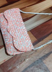 beautiful stylish orange and white colour sling ba