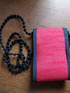 Embroidered sling bag