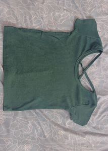 Green top with criss cross design on back