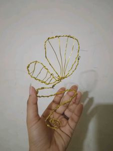Golden Butterfly Wire arm cuffs.