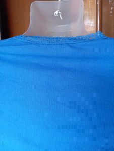 Blue Ribbed Lettuce Hem Top