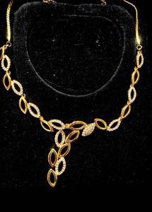 Elegant Gold Necklace with Crystals