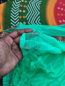 Elegant Green Saree with Intricate Border