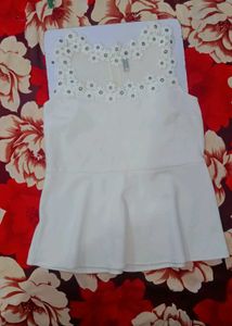 Chic White Peplum Top with Floral Neckline