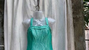 232112. Stunning Teal Tiered Gown