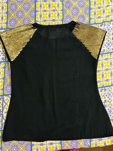 Black top with Gold sequins sleeves